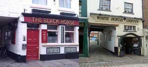 The White Horse and the Black Horse public houses in Whitby, in reality they are not quite next door to each other as they look in this picture